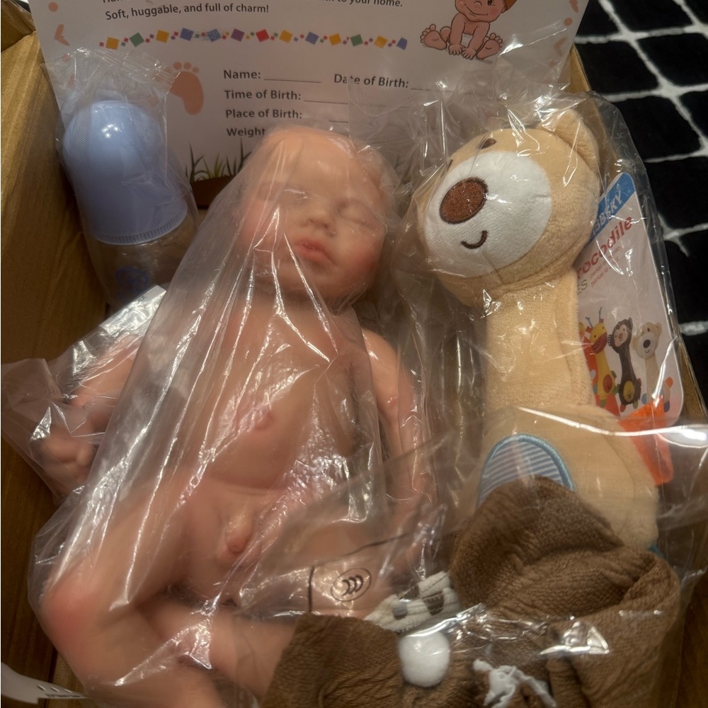 Beige Reborn Baby Doll with Brown Plush Rattle - Infant Playset